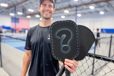 Brandon holding an unspecified pickleball paddle